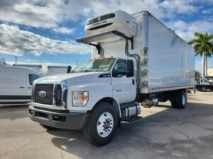 Front side view New 2026 Ford F-750 with 26 foot Wabash Refrigerated box and 3500 pound liftgate