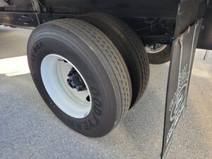 Rear Dual Wheels of the xRear Lift Gate and Roll up door New 2026 Ford F-750 with 26 foot Wabash Refrigerated box and 3500 pound liftgate
